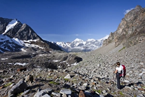Hiker during ascent of Mt Tschenglser Hochwand above Duesseldorfer Huette hut in Sulden Hiker during ascent of Mt Tschenglser Hochwand above Duesseldorfer Huette hut in Sulden