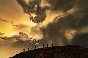 Hikers on the storm at sunset, Catbells Mountain, Lake District. UK Hikers on the storm at sunset, Catbells Mountain, Lake District. UK