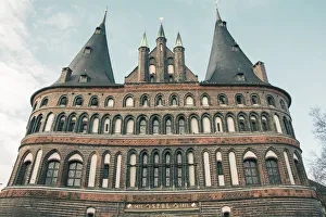 The Holsten Gate or Holstein Tor (Holstentor), a brick gothic city gate at the Hanseatic city of Lubeck, Germany The Holsten Gate or Holstein Tor (Holstentor), a brick gothic city gate at the Hanseatic city of Lubeck, Germany