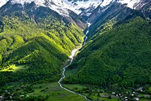 Horizontal view on Waterfall at Mountain road at Mount Ushba in the Caucasus of Georgia Horizontal view on Waterfall at Mountain road at Mount Ushba in the Caucasus of Georgia