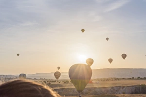 Hot air balloon flying over Cappadocia at morning Hot air balloon flying over Cappadocia at morning