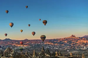 Hot air balloon flying over spectacular Cappadocia Hot air balloon flying over spectacular Cappadocia