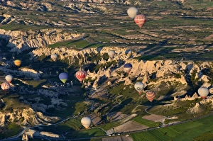 <b class=qtipBold><figcaption>Hot air balloons over Cappadocia</figcaption></b><br>Hot air balloons over Cappadocia tufa badlands at GA¶reme and Uchisar, Central Anatolia, Turkey. Early morning flight, golden sunrise light.<br><em>© Federica Grassi</em> Hot air balloons over Cappadocia