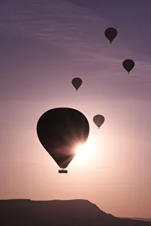 Hot air balloons flying above rock formations, Goreme National Park, Goreme, Cappadocia Hot air balloons flying above rock formations, Goreme National Park, Goreme, Cappadocia