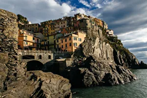 Houses on a cliff in Manarola village in Cinque Terre National Park, Liguria, Italy Houses on a cliff in Manarola village in Cinque Terre National Park, Liguria, Italy