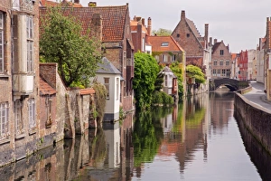 Houses near the water canal in Bruges, Belgium Houses near the water canal in Bruges, Belgium