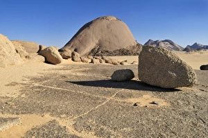 Huge granite dome at Tehenadou, Adrar nAhnet, Adrar Ahnet, Algeria, Sahara, North Africa Huge granite dome at Tehenadou, Adrar nAhnet, Adrar Ahnet, Algeria, Sahara, North Africa