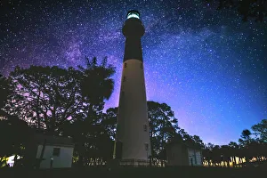 <b class=qtipBold><figcaption>Hunting Island Light House</figcaption></b><br>The hunting island light house at night below the stars.<br><em>© Robert Loe</em> Hunting Island Light House