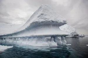<b class=qtipBold><figcaption>Iceberg Perspective</figcaption></b><br>Iceberg floating in Scoresbysund fjord on the eastern side of Greenland. On this iceberg it looks as though it has floated in the water as 3 different depths.<br><em>©  2016 Wildestanimal</em> Iceberg Perspective