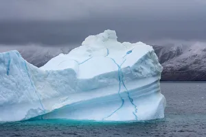 Iceberg shows veins of frozen meltwater, King Oscar Fjord, Greenland National Park Iceberg shows veins of frozen meltwater, King Oscar Fjord, Greenland National Park