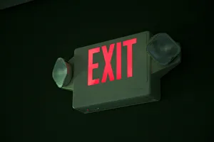 Illuminated Exit sign in a restaurant, USA Illuminated Exit sign in a restaurant, USA
