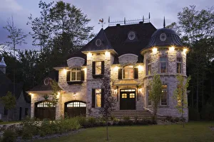 Illuminated luxurious cottage-style residential house with two garages, Quebec Province, Canada Illuminated luxurious cottage-style residential house with two garages, Quebec Province, Canada