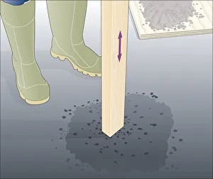 Illustration of tamping down asphalt using wooden post Illustration of tamping down asphalt using wooden post
