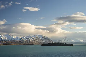 Island in Lake Tekapo in front of a mountain range, Canterbury Region, South Island Island in Lake Tekapo in front of a mountain range, Canterbury Region, South Island