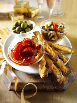 Italian Party buffet food with dried tomatoes, bread sticks or bread sticks Italian Party buffet food with dried tomatoes, bread sticks or bread sticks