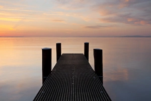 Jetty in the evening light overlooking Lake Constance near Bregenz, Rohrspitz, Austria Jetty in the evening light overlooking Lake Constance near Bregenz, Rohrspitz, Austria