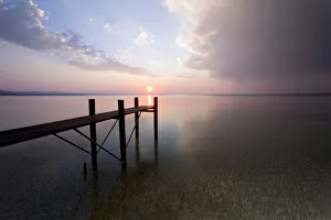 Jetty with evening light and stormy atmosphere overlooking Lake Constance near Bregenz Jetty with evening light and stormy atmosphere overlooking Lake Constance near Bregenz