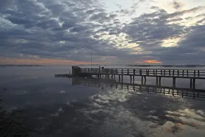 Jetty at Federsee lake, clouds, reflections, Federsee lake nature reserve, morning mood Jetty at Federsee lake, clouds, reflections, Federsee lake nature reserve, morning mood