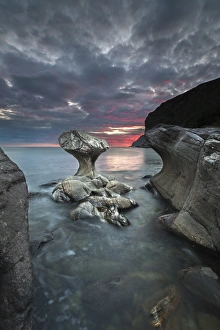 Kannestein or Kanne Stone with coastline at sunset, Vagsoy island, Sogn og Fjordane Kannestein or Kanne Stone with coastline at sunset, Vagsoy island, Sogn og Fjordane