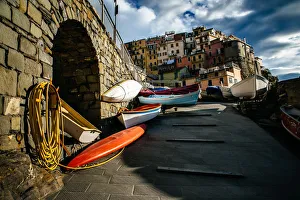Kayaks with colorful houses of Manarola village in Cinque Terre National Park, Liguria Kayaks with colorful houses of Manarola village in Cinque Terre National Park, Liguria