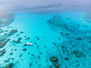 Kerama Islands National Park with clear tropical water and boat from above, Okinawa Kerama Islands National Park with clear tropical water and boat from above, Okinawa