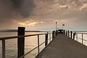 Lake Constance and approaching thunder clouds in the evening, pier in Mannenbach, Switzerland, Europe Lake Constance and approaching thunder clouds in the evening, pier in Mannenbach, Switzerland, Europe