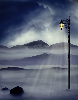 <b class=qtipBold><figcaption>Lamppost shining warm golden light</figcaption></b><br>Lamppost shining warm golden light with mountains.<br><em>© copyright 2011 Chiaralily</em> Lamppost shining warm golden light
