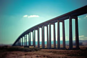 Large concrete bridge looming over a landscape Large concrete bridge looming over a landscape