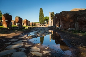 A large puddle in the ruins of the Ancient Roman harbour city of Ostia Antica in Rome A large puddle in the ruins of the Ancient Roman harbour city of Ostia Antica in Rome
