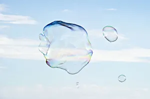 Large soap bubbles in front of a bright blue sky Large soap bubbles in front of a bright blue sky