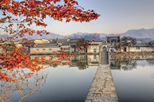 <b class=qtipBold><figcaption>Late fall morning at Hongcun</figcaption></b><br>Red maple tree is at entrance bridge head to village of Hongcun, historical village in Anhui province, China.<br><em>© 2008 Xiaoyu Yu</em> Late fall morning at Hongcun