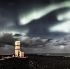 <b class=qtipBold><figcaption>Lighthouse with Aurora Borealis</figcaption></b><br>Northern Lights over Garda lighthouse, Reykjanes, Peninsula, Iceland<br><em>© Arctic-Images</em> Lighthouse with Aurora Borealis