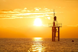 Lighthouse at sunrise, at Hoernle, Lake Constance, Konstanz, Baden-Wurttemberg, Germany Lighthouse at sunrise, at Hoernle, Lake Constance, Konstanz, Baden-Wurttemberg, Germany