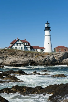 Lighthouse, waves breaking on rocks, Portland Head Light, Cape Elizabeth, Portland, Maine Lighthouse, waves breaking on rocks, Portland Head Light, Cape Elizabeth, Portland, Maine