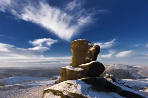 Loaf and Cheese rock in the snow on Ramshaw Rocks. located between Buxton and Leek in the Peak District Loaf and Cheese rock in the snow on Ramshaw Rocks. located between Buxton and Leek in the Peak District