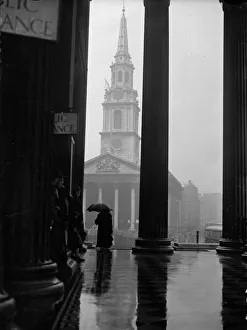 <b class=qtipBold><figcaption>London Spire</figcaption></b><br>January 1928: The church of St Martin-in-the-Fields viewed through the pillars of the National Gallery's portico on a rainy day. (Photo by Fox Photos/Getty Images) London Spire