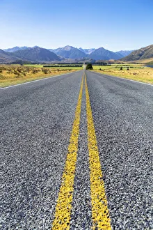 The long straight West Coast Road 73, Mt. Horrible, 1234m, at the rear, Canterbury Region The long straight West Coast Road 73, Mt. Horrible, 1234m, at the rear, Canterbury Region