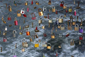 Love locks, padlocks, as a sign of live, at the main bridge over the Mur river, Graz Love locks, padlocks, as a sign of live, at the main bridge over the Mur river, Graz