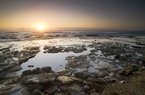 iSimangaliso Wetland Park Collection: Low angle sunrise over Indian Ocean Mission rocks St Lucia, Kwazulu-Natal South Africa