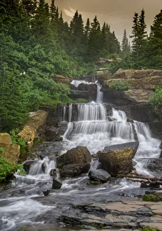 <b class=qtipBold><figcaption>Lunch Creek Falls</figcaption></b><br>Lunch Creek falls in Glacier NP<br><em>© Russell Burden</em> Lunch Creek Falls