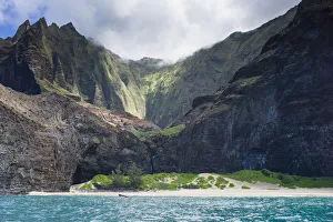 Majestic views of extreme terrain at Honopu Beach along the Na Pali Coast, Kauai, Hawaii Majestic views of extreme terrain at Honopu Beach along the Na Pali Coast, Kauai, Hawaii