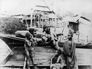 <b class=qtipBold><figcaption>Malay Shipbuilder</figcaption></b><br>A Malay shipbuilder surrounded by children, circa 1930. (Photo by Hulton Archive/Getty Images)<br><em>© 2007 Getty Images</em> Malay Shipbuilder