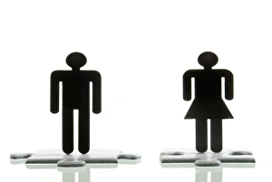 Male figure and a female figure standing on jigsaw puzzle pieces, symbolic image for looking for a partner Male figure and a female figure standing on jigsaw puzzle pieces, symbolic image for looking for a partner