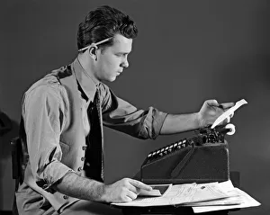 Man In Office At Adding Machine, Looking At Tape Man In Office At Adding Machine, Looking At Tape