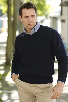Man wearing casual clothes standing in an avenue Man wearing casual clothes standing in an avenue