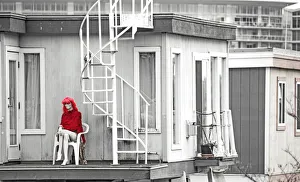 <b class=qtipBold><figcaption>Mannequin on boat deck</figcaption></b><br>A female mannequin on a deck with red clothing and the rest of the image in black and white.<br><em>© Richard Goerg</em> Mannequin on boat deck