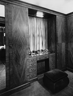 <b class=qtipBold><figcaption>Masculine Dressing Table</figcaption></b><br>The masculine dressing table in the flat belonging to Douglas Sheart, 1930. The dressing table is built into the wardrobes and has a velvet stool. (Photo by Sasha/Hulton Archive/Getty Images)<br><em>© 2010 Getty Images</em> Masculine Dressing Table