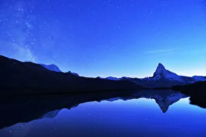 Matterhorn with Milky Way reflected in lake Stellisee, at night, Valais Alps, Canton of Valais, Zermatt, Switzerland Matterhorn with Milky Way reflected in lake Stellisee, at night, Valais Alps, Canton of Valais, Zermatt, Switzerland