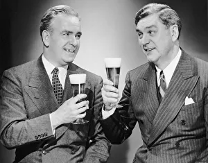 <b class=qtipBold><figcaption>Two men with alcoholic beverages</figcaption></b><br>UNITED STATES - CIRCA 1950s: Two men with alcoholic beverages.<br><em>© George Marks</em> Two men with alcoholic beverages