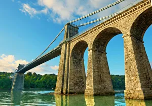 Menai Suspension Bridge, completed in 1826, crossing the Menai Strait between the Menai Suspension Bridge, completed in 1826, crossing the Menai Strait between the